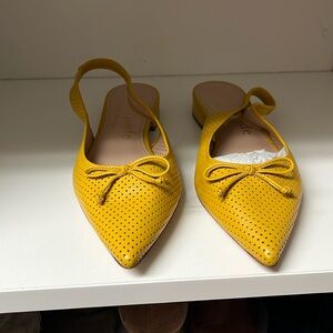 Kate spade yellow flats. New in box never worn.  Size 7.5
